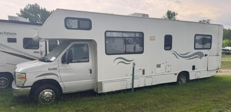 Large camper in outdoor storage