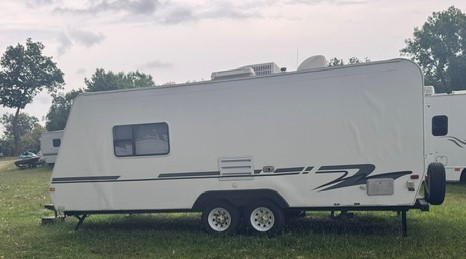 Medium camper in outdoor storage